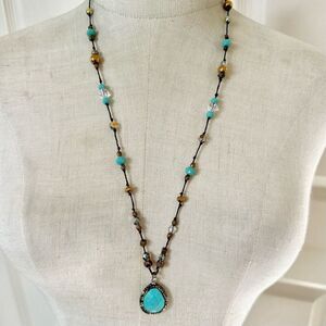 Blue and gold tone beaded long teardrop pendant necklace